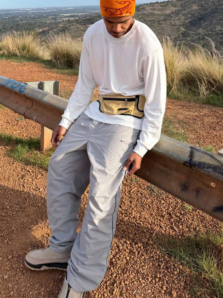 Nike Track pants + Arcteryx Beanie + Diesel Bum bag + ACG mules