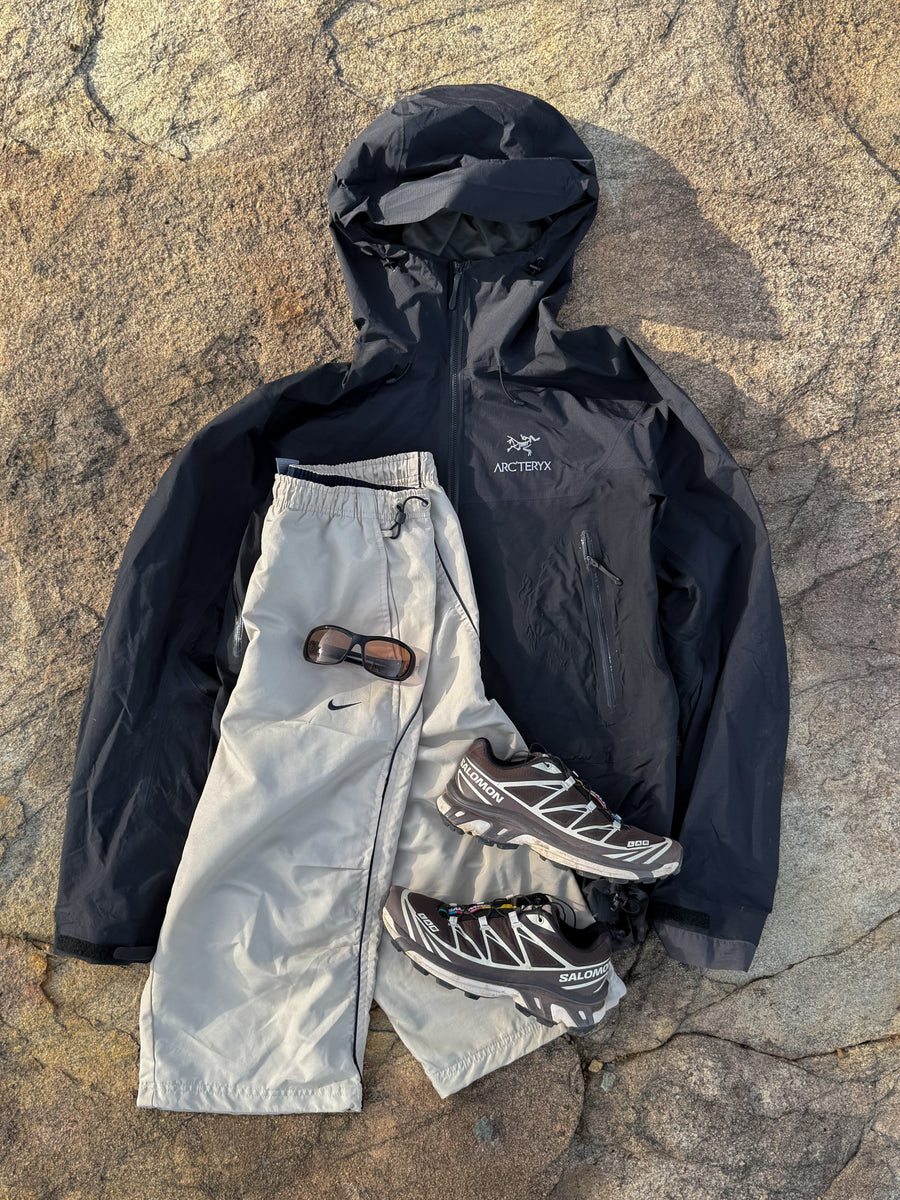 Nike parachute shorts + Arcteryx Shell Jacket